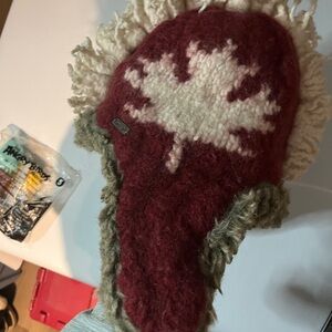 Delux 100% wool hat with red leaf on it. Mohawk on the top. warm unique Canadian
